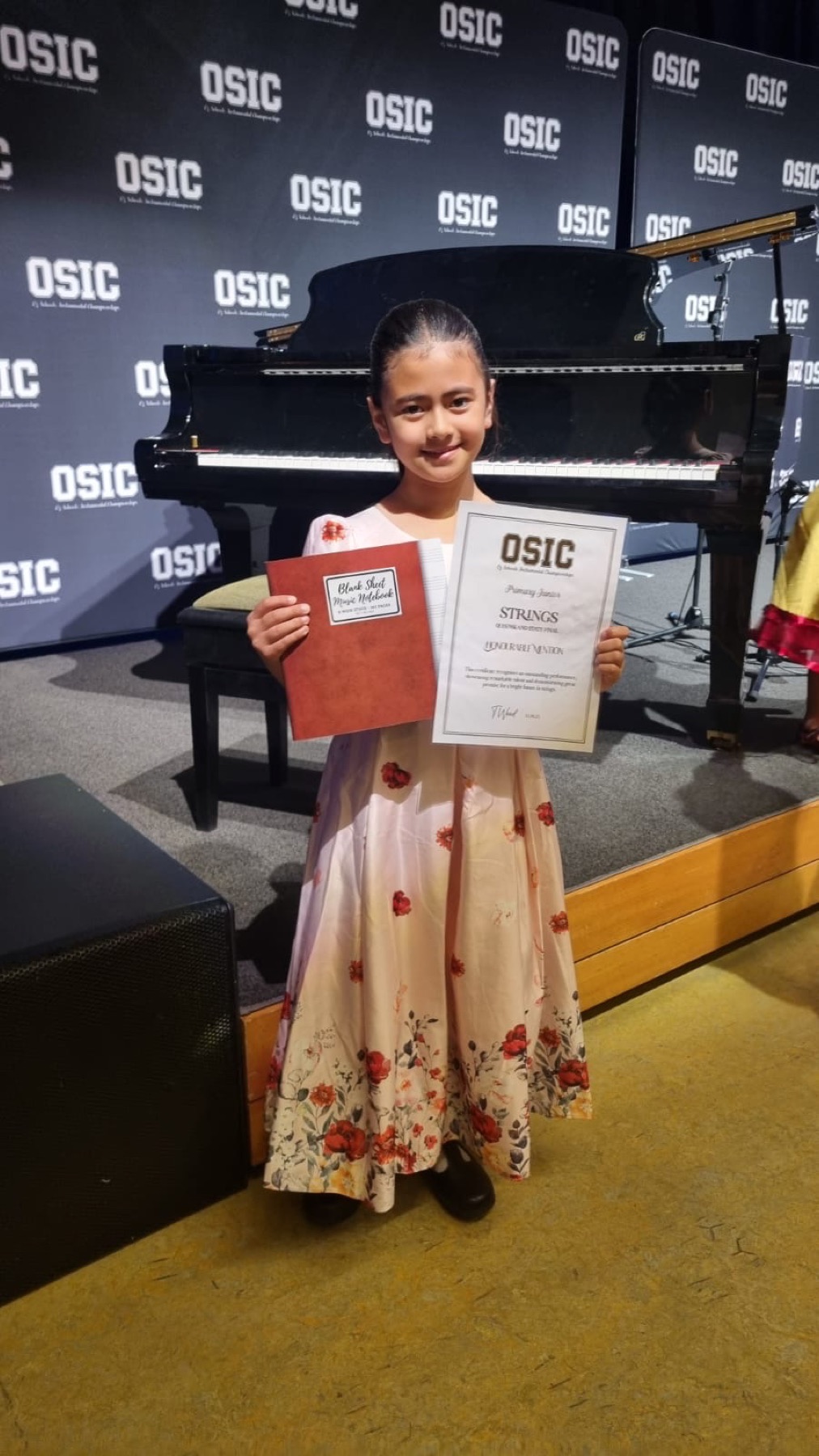 Young student receiving a strings award
